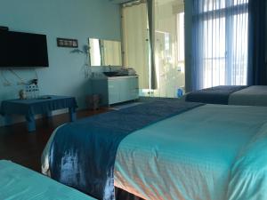 Postel nebo postele na pokoji v ubytování Jing Xiang Hua Nong B&B