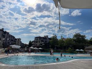 a group of people in a swimming pool at Heritage in Oasis Resort Lozenets in Lozenets