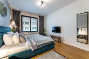 Katil atau katil-katil dalam bilik di Apartment Invalidovna with FREE parking