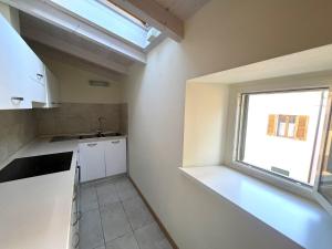 A kitchen or kitchenette at Appartamenti Lungomare Seafront - Goelba