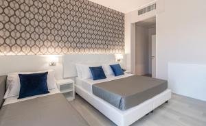 Postel nebo postele na pokoji v ubytování Hotel Biancamano