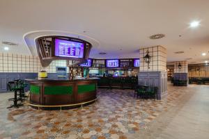 a bar in a casino with a bar at Kremlin Palace in Lara