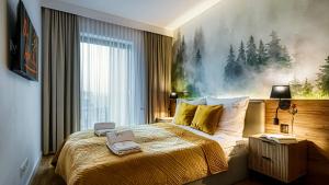 Postel nebo postele na pokoji v ubytování Apartamenty - Źródło Izery Prestige - Wellness & Family Przy Gondoli by OnHoliday Świeradów-Zdrój