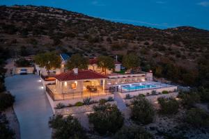 an aerial view of a house with a swimming pool at Villa La Meravigliosa in Vodice