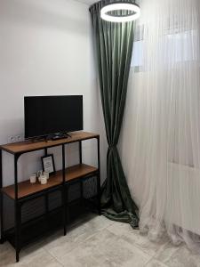 Μια τηλεόραση ή/και κέντρο ψυχαγωγίας στο Vista apartment 4