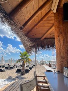 a view of a beach with chairs and umbrellas at Heritage in Oasis Resort Lozenets in Lozenets
