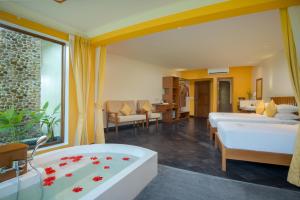 Postel nebo postele na pokoji v ubytování Komsan Kampot Resort