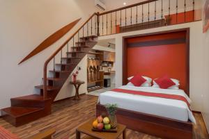 Postel nebo postele na pokoji v ubytování Komsan Kampot Resort