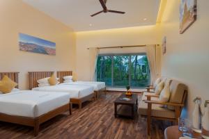 Postel nebo postele na pokoji v ubytování Komsan Kampot Resort