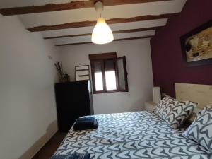 Ein Bett oder Betten in einem Zimmer der Unterkunft Casa Valentina y La buhardilla