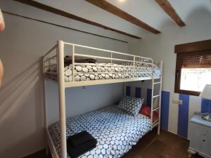 Ein Bett oder Betten in einem Zimmer der Unterkunft Casa Valentina y La buhardilla