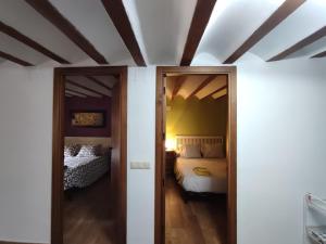 Ein Bett oder Betten in einem Zimmer der Unterkunft Casa Valentina y La buhardilla