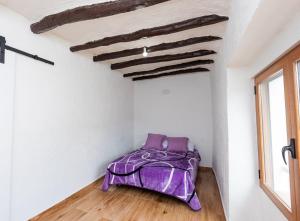 A bed or beds in a room at Casas Rurales Sagasta