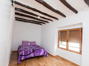 A bed or beds in a room at Casas Rurales Sagasta