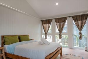 Ein Bett oder Betten in einem Zimmer der Unterkunft The Yard Hostel Chiang Mai