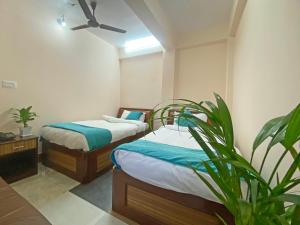 Una cama o camas en una habitación de Hotel Resunga Arjun