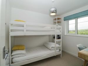 Ένα ή περισσότερα κρεβάτια σε δωμάτιο στο Croyde Pebbles