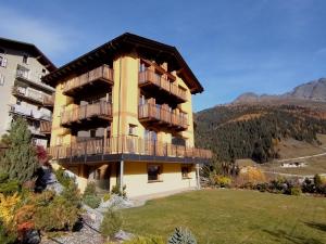 a building with balconies on the side of it at Chalet MAOL Luxury Living in Valdidentro