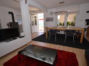 a living room with a table and a dining room at Marvelous Escape Bol Island Villa with Pool in Bol
