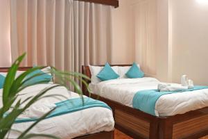 Una cama o camas en una habitación de Hotel Resunga Arjun