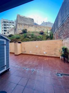 a patio with a wooden fence with plants on it at CarreraHouses Benilde con Garaje in Vigo