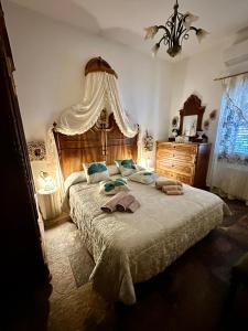 Postel nebo postele na pokoji v ubytování Domo All'Antico Borgo
