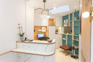 an office with a desk with a computer on it at Wardonia Hotel Kings Cross in London