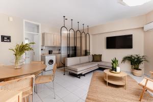 a living room with a couch and a table at K Houses B3 in Arta