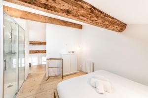 Rúm í herbergi á Loft mezzanine vue incroyable Saône