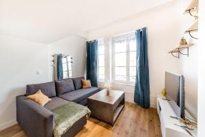 Televízia a/alebo spoločenská miestnosť v ubytovaní Loft mezzanine vue incroyable Saône