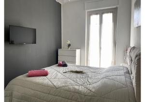 A bed or beds in a room at Appartamento Le Risaie