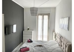 A bed or beds in a room at Appartamento Le Risaie