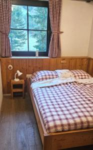 Rúm í herbergi á Fleissner Hütte
