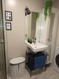 a bathroom with a sink and a mirror at Maja’s lovely place in Velika Gorica