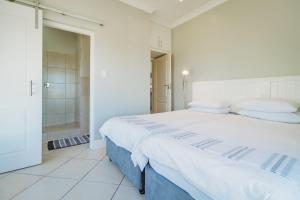 Ένα ή περισσότερα κρεβάτια σε δωμάτιο στο Palms Manor on Kingswood Golf Estate