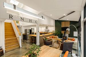 a restaurant with a wooden table and chairs at Dragons Barn with Hot Tub in Great Malvern