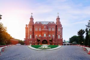 a large brick building with a fountain in front of it at Kremlin Palace in Lara