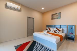 Ένα ή περισσότερα κρεβάτια σε δωμάτιο στο Villa Aura Chiang Mai