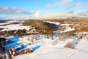 an aerial view of a resort in the snow at Azureva Métabief in Métabief