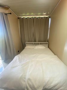 Postel nebo postele na pokoji v ubytování Portia Beach Grand