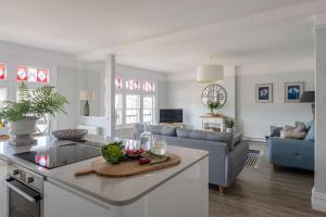 a kitchen and living room with a counter top at Waterside in Dartmouth