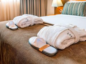 Ein Bett oder Betten in einem Zimmer der Unterkunft Mercure Lisboa Almada