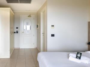 Postel nebo postele na pokoji v ubytování B&B HOTEL Pomezia Cortese