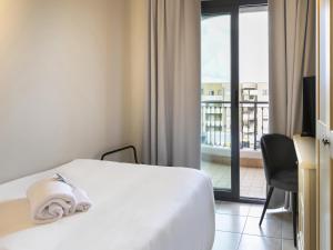Postel nebo postele na pokoji v ubytování B&B HOTEL Pomezia Cortese