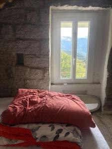 En eller flere senge i et værelse på Haut de maison de village