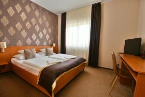 Postel nebo postele na pokoji v ubytování Hotel Platan