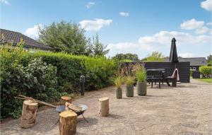 A garden outside Awesome Home In Haderslev With Kitchen