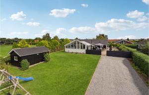 A garden outside Awesome Home In Haderslev With Kitchen