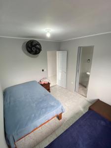 Katil atau katil-katil dalam bilik di Suite 5 a 3 quadras da praia