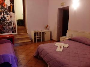 Posteľ alebo postele v izbe v ubytovaní Locanda Scirocco